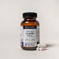 A brown bottle labeled "5-HTP 100 mg" with three white capsules on a plain light background.
