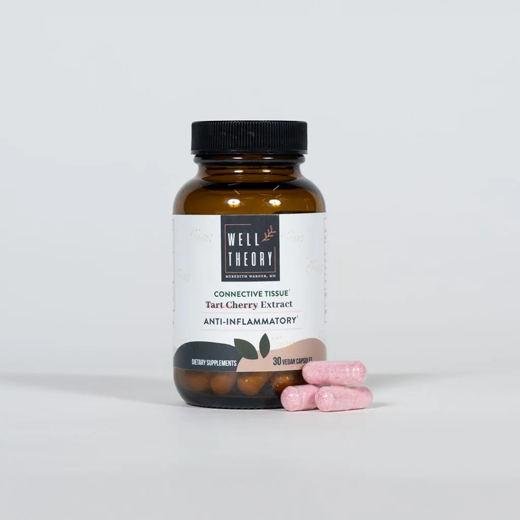 Brown bottle labeled "Tart Cherry Extract: Inflammation & Muscle Recovery" with four pink capsules next to it.
