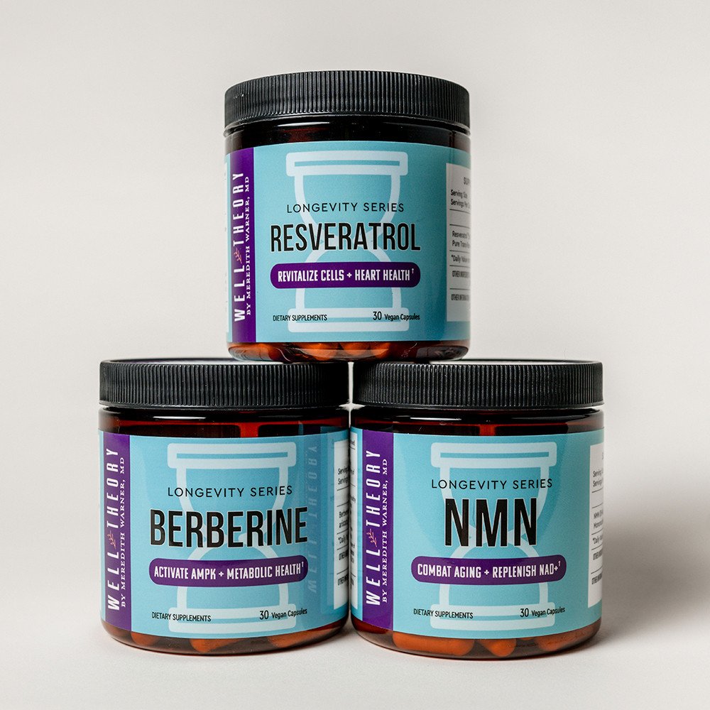 Three jars of Well Theory Longevity Series supplements are stacked together, promoting natural wellness support.