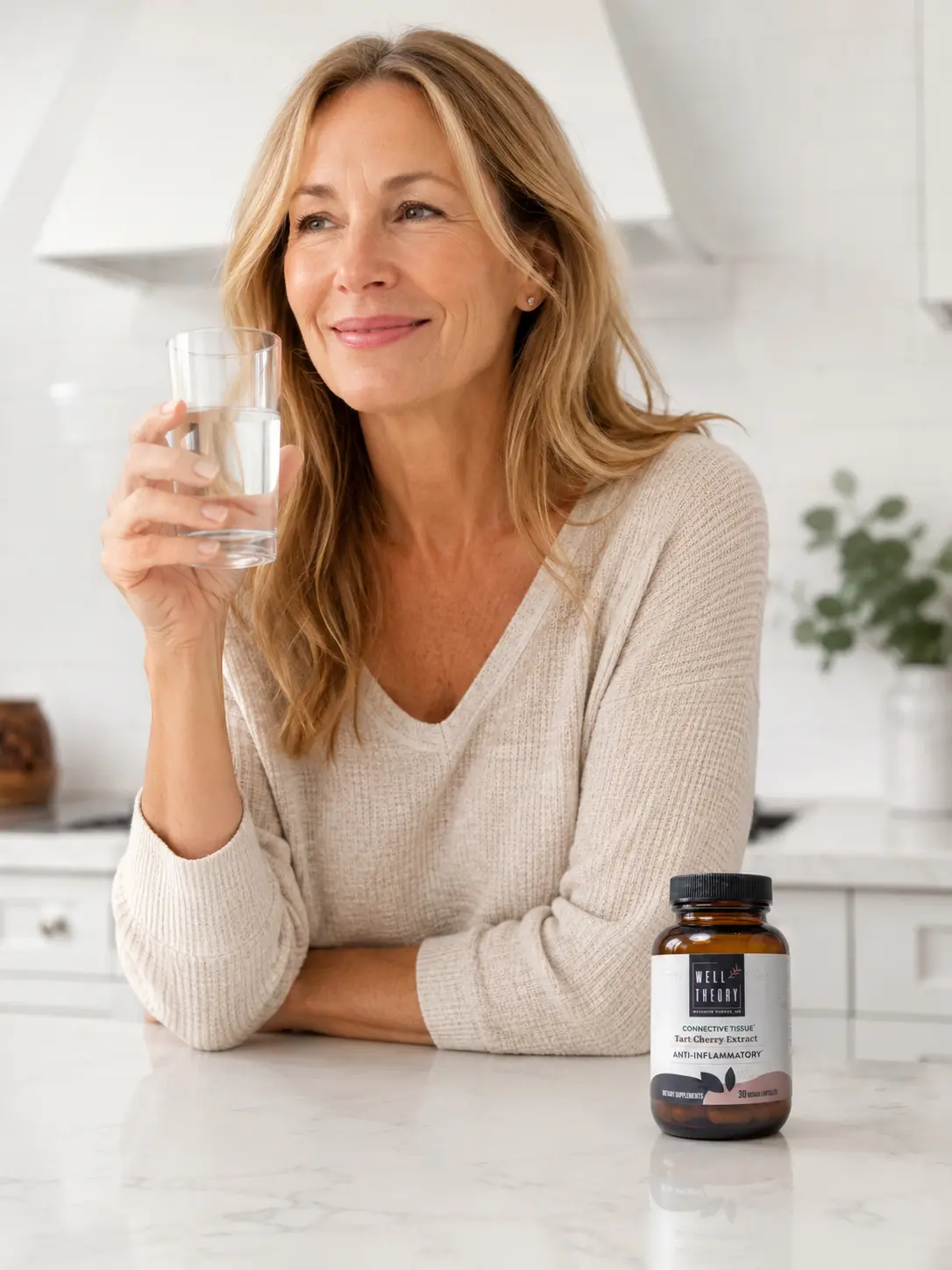Adult taking supplements as part of a consistent morning wellness routine