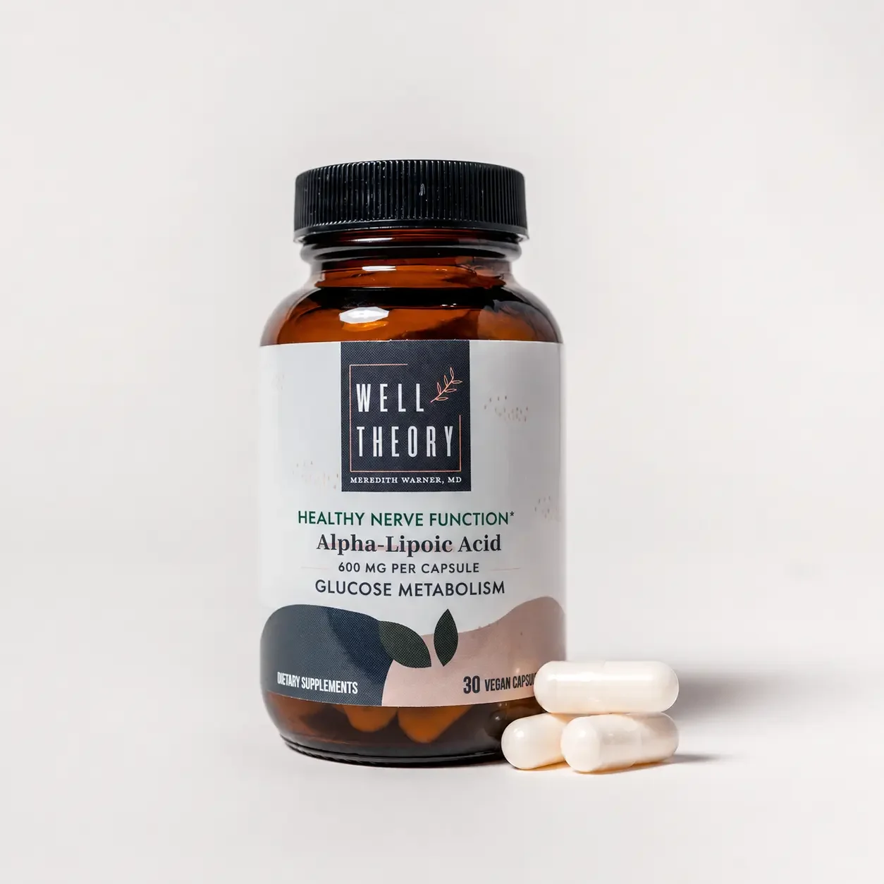 One hand holds a Well Theory Alpha-Lipoic Acid bottle while the other displays a single capsule next to it.