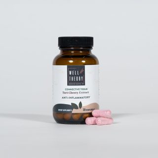 Brown bottle labeled "Tart Cherry Extract: Inflammation & Muscle Recovery" with four pink capsules next to it.
